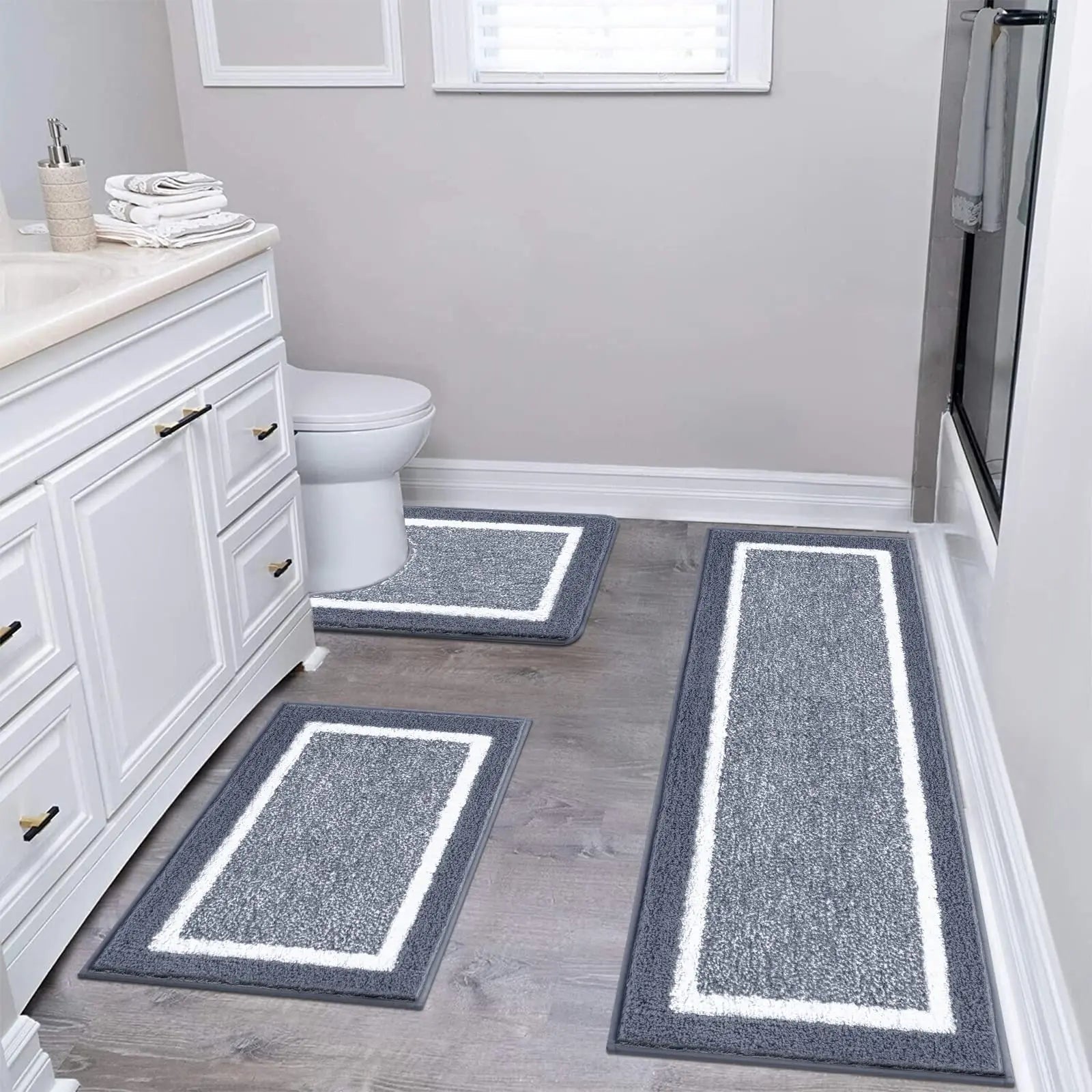 Gray three-piece bathroom rug set